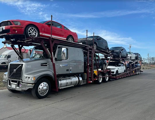 Red Shelby Mustang loaded on an Allstar Hauling car carrier