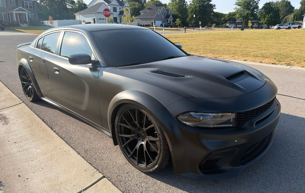Satin black Dodge Charger Widebody hauled by Allstar Hauling