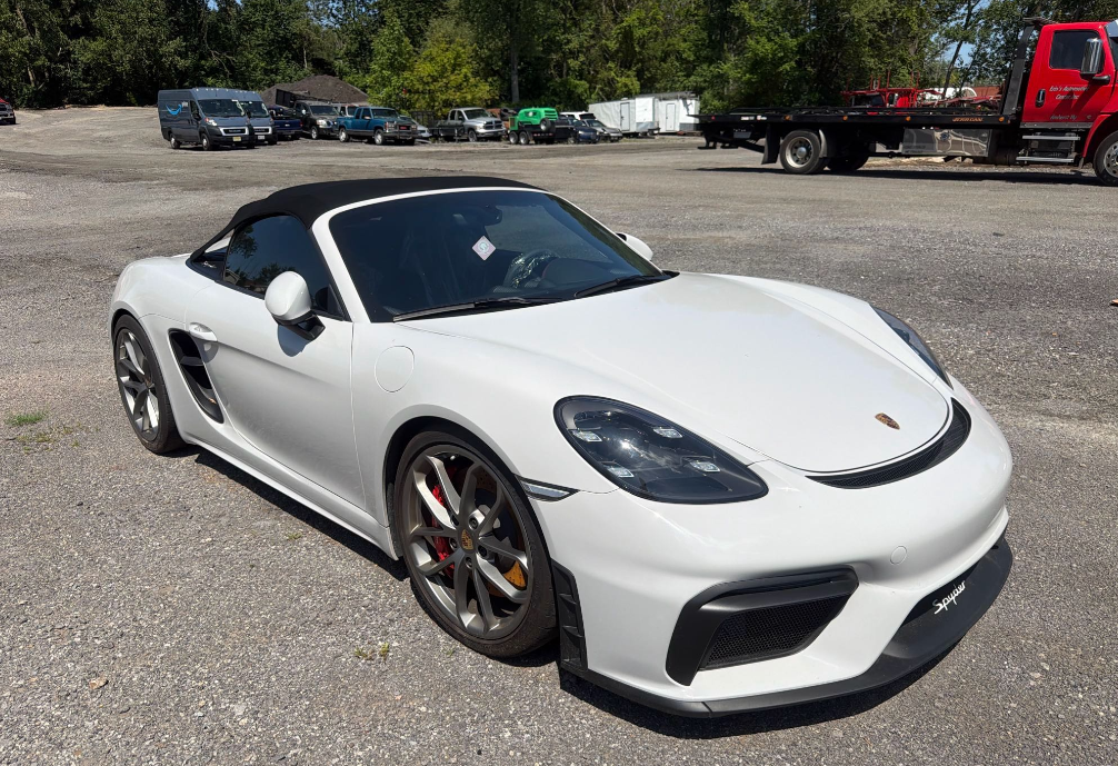 White Porsche 718 Spyder convertible before Allstar Hauling transport