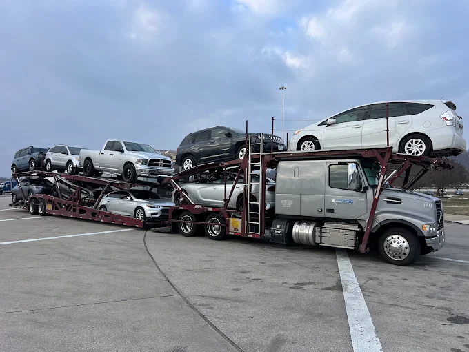 Allstar Hauling nine-car Volvo carrier loaded with pickups, SUVs and sedans on its first trip