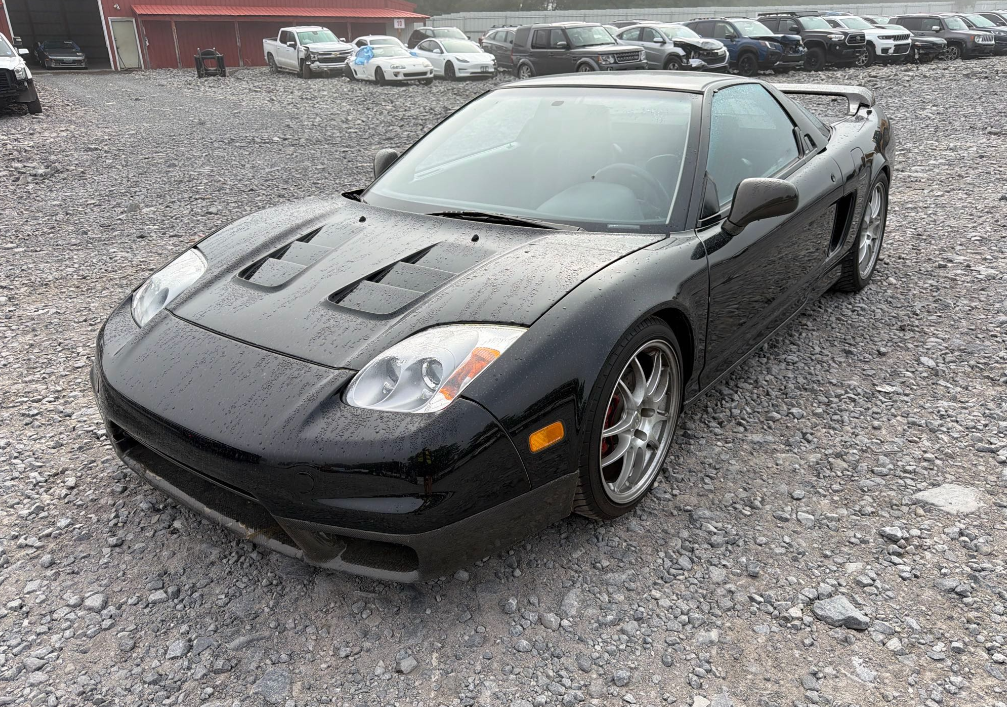 Black 1991 Acura NSX loaded for transport by Allstar Hauling