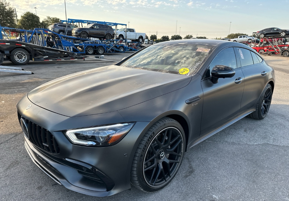 Matte gray Mercedes-AMG GT 53 4-door coupe before Allstar Hauling transport