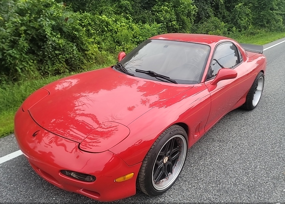 Red Mazda RX-7 FD sports car transported by Allstar Hauling