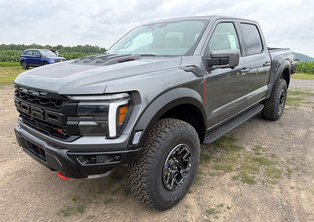 Gray Ford F-150 Raptor R pickup hauled by Allstar Hauling