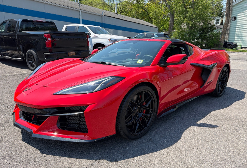 Red Chevrolet Corvette C8 Z06 hauled by Allstar Hauling